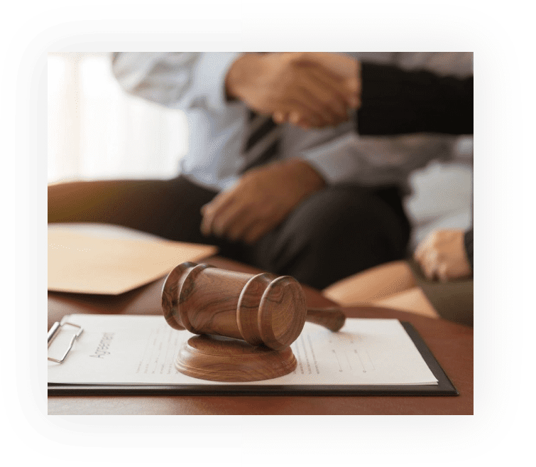 A judge 's gavel sitting on top of a table.